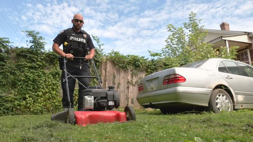 officer mows yard 1