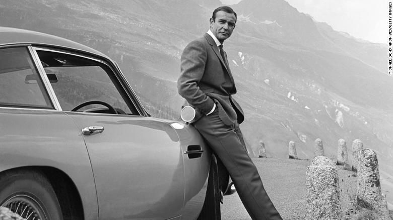 Sean Connery as James Bond poses with Aston Martin.jpg
