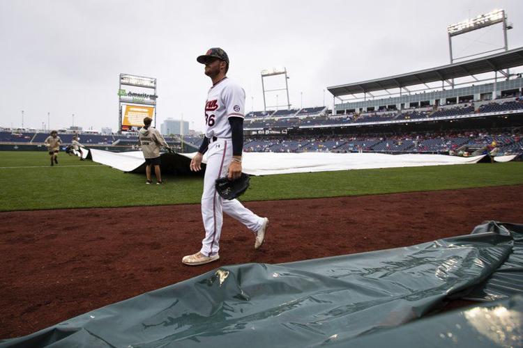 Auburn's Kyle Gray walks past the grounds crew