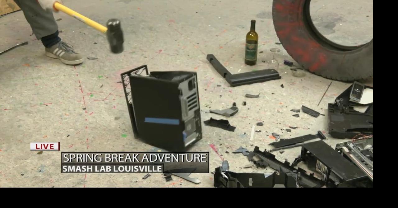 Keith Kaiser lets off some steam on a computer tower at Smash Lab