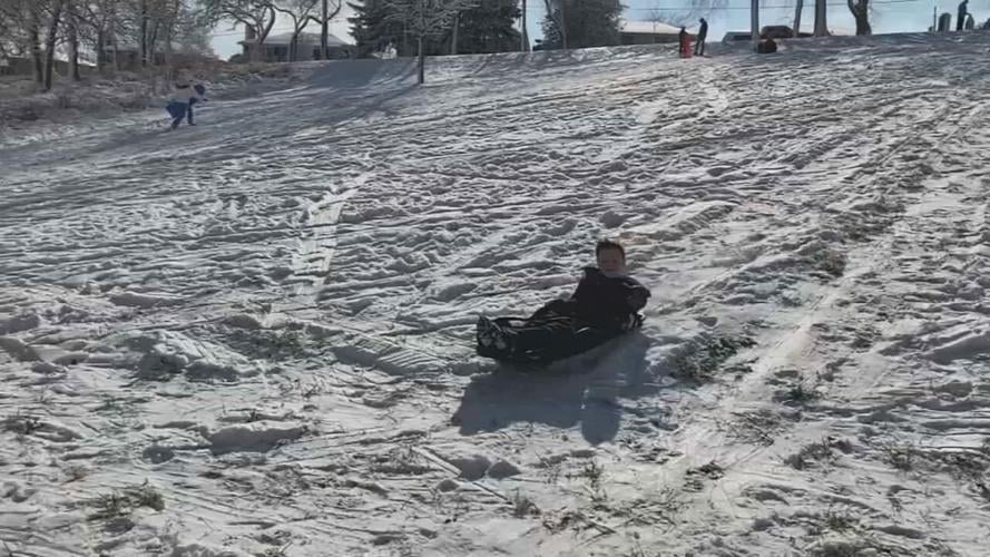 Kid sledding at a Louisville park (generic)