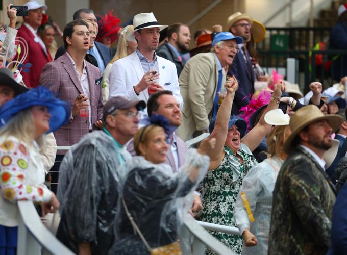 People cheer during race 11 - May 3.JPG