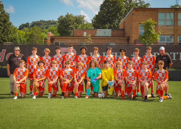 Lee Smith poses with DeSales soccer team