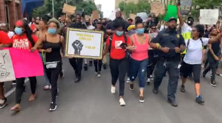 Protesters and police link arms (2) 6-1-20