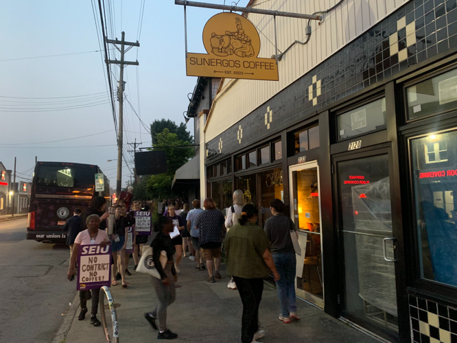 Protesters outside Sunergos Coffee on Preston Street in Louisville