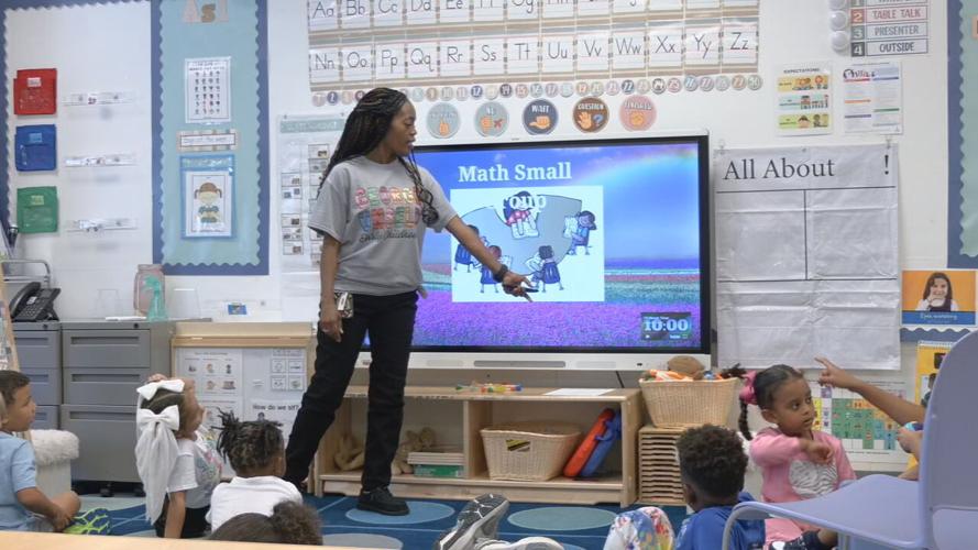 Students listen to teacher at George Unseld Early Childhood Learning Center