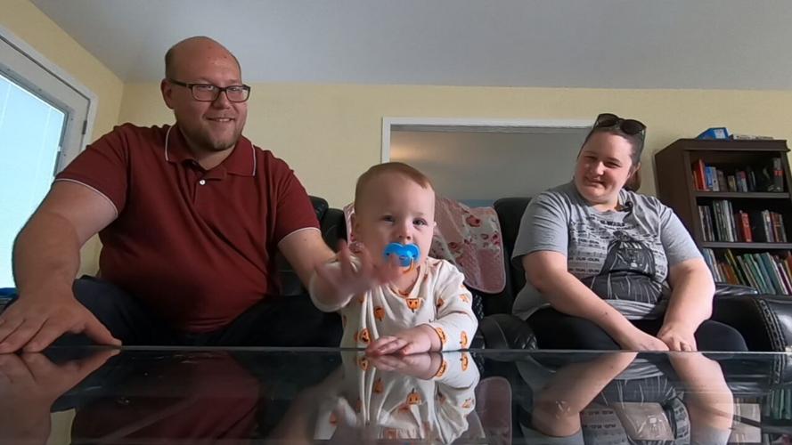 Nine-month-old Georgia State, with dad, Kevin (left) and mom, Ashley, (right)