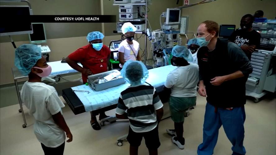 Master P with children taking part in Christopher 2X's Future Healers program