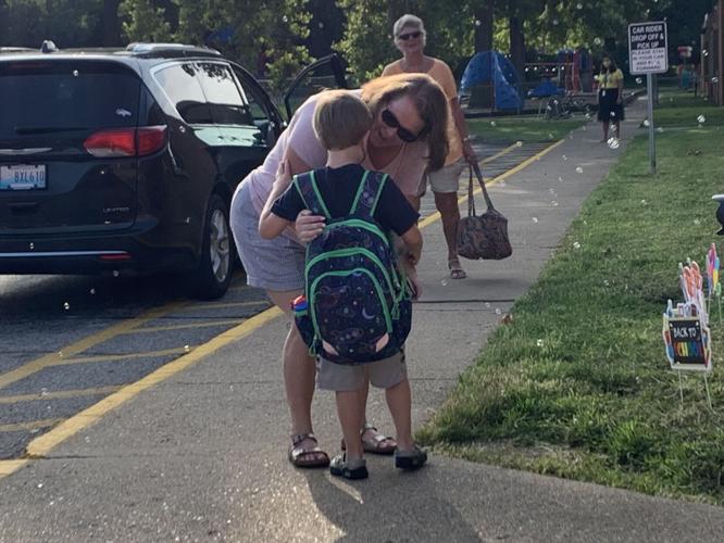 Bowen Elementary back to school drop off hug jcps 08-10-22.jpg