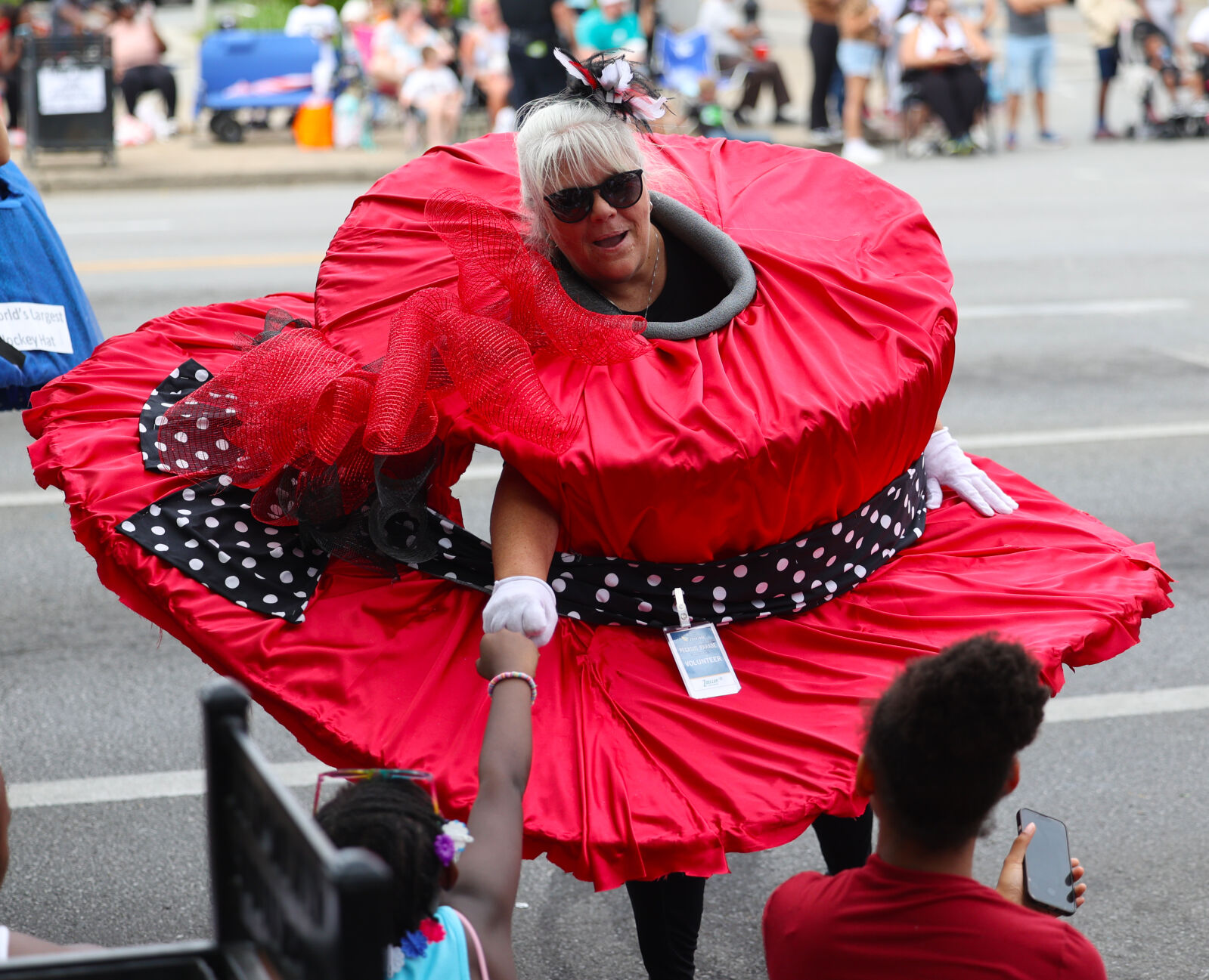 Fist bump by derby hat in parade.JPG