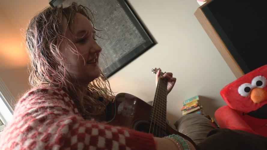 Katie Cowan plays a song