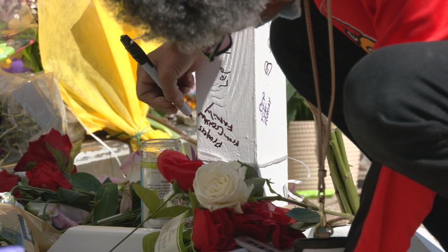 The community memorial outside Old National Bank continued to grow on Thursday, April 13, 2023.