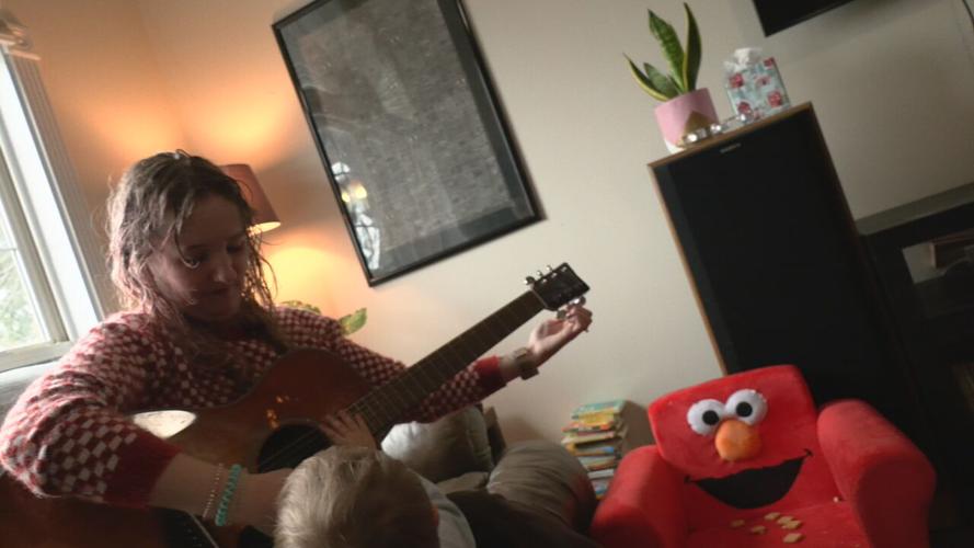 Katie Cowan plays a song