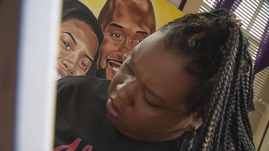 Jaylin Stewart, a local artist, paints in her studio. She recently completed a painting of Kobe and Gigi Bryant
