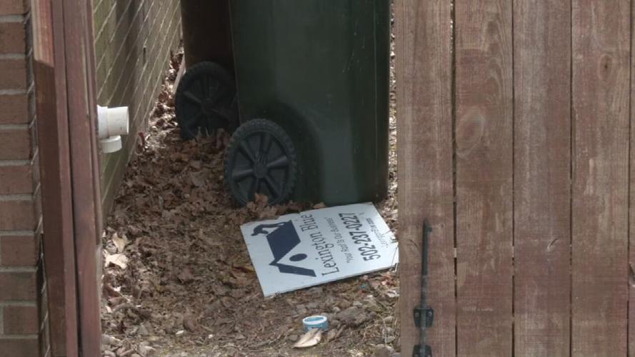 Lexington Blue sign near trash at Louisville office 4-16-25