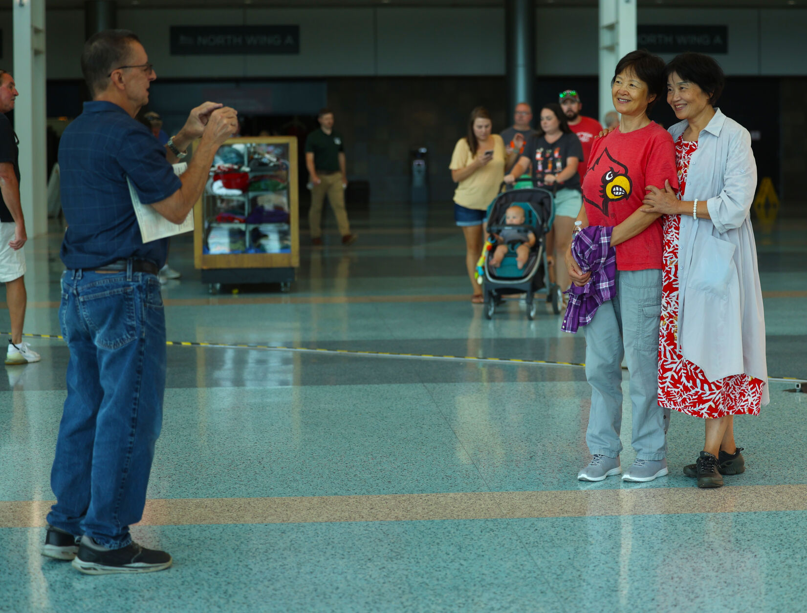 People take a photo near state fair sign.JPG