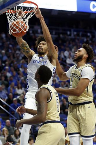Kentucky's Nick Richards, top left, dunks near Georgia Tech's Moses Wright
