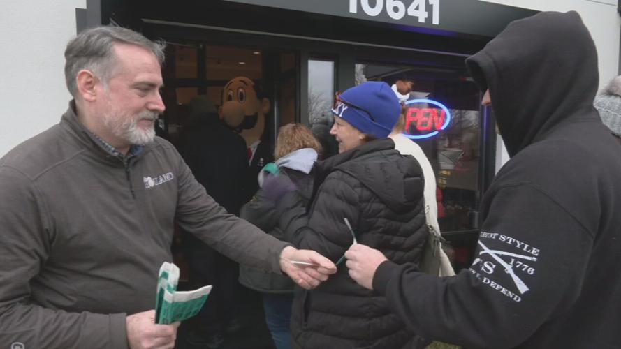 Customers waiting in line for grand opening of Louisville's first LaRosa's Pizza location