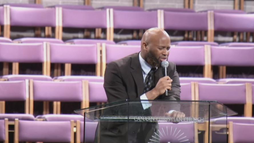 A singer preforms at David McAtee's funeral service