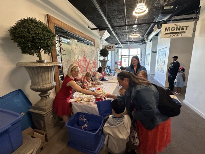 People check in at tea with Royal Court.jpg