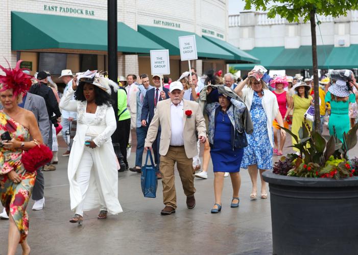 People walk in the rain Churchill Downs.JPG