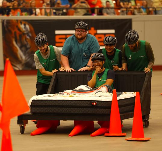 Team hits cone at Bed Races.JPG
