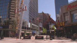 Naked man detained after downtown Louisville car break-in, shower in sprinkler