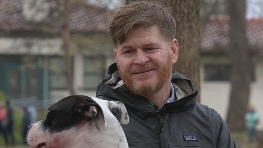 Arlo and Jonathan sit on park bench