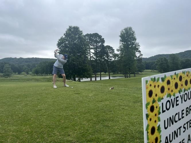 A golfer at the third annual Madelynn Troutt Memorial Golf Scramble