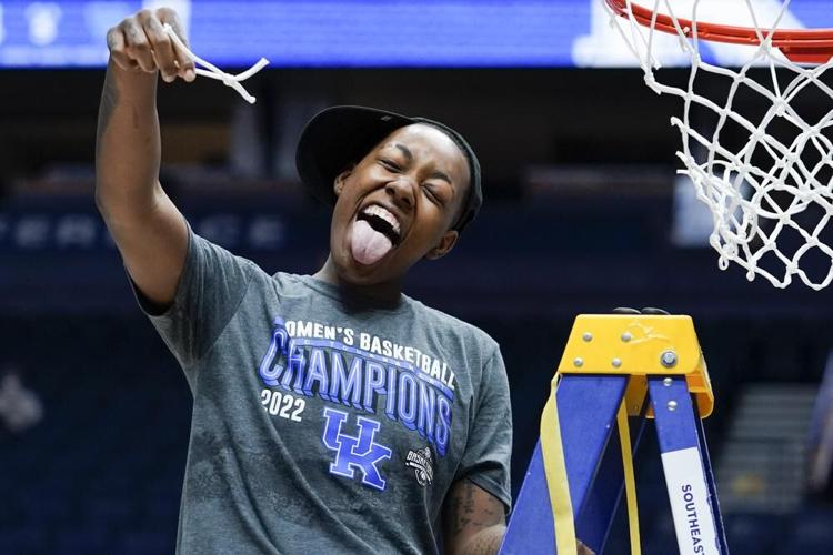 Kentucky's Dre'una Edwards cuts the net after Kentucky beat South Carolina.jpeg