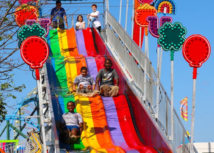 Children move down slide during Sensory Awareness Day.JPG