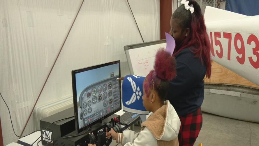 Students at flight simulator at Academy@Shawnee