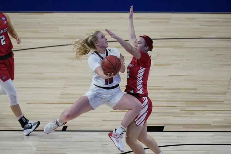 Louisville guard Hailey Van Lith (10) drives to the basket against Marist