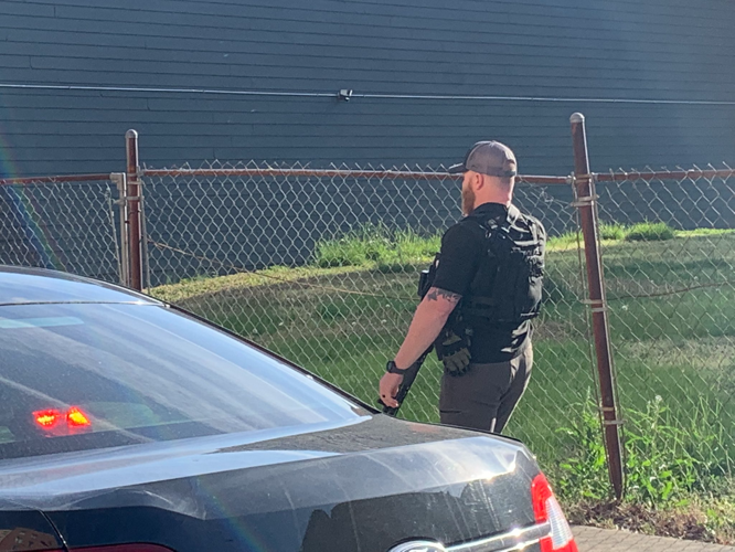 LMPD officer with tactical gear near downtown shooting investigation