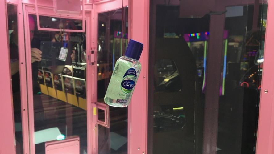 Claw machine with sanitizer