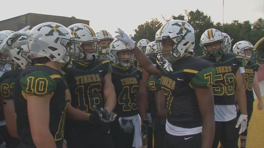 St. Xavier football huddles