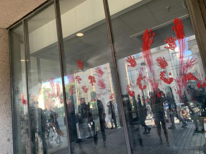 5-29-20 protest red paint hands on windows