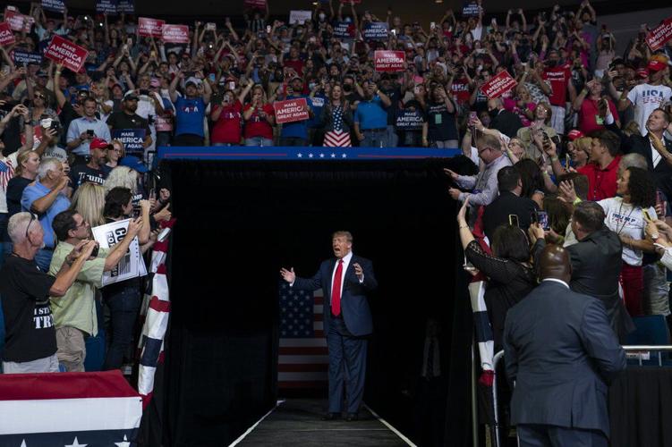 President Donald Trump arrives on stage to speak at a campaign rally at the BOK Center