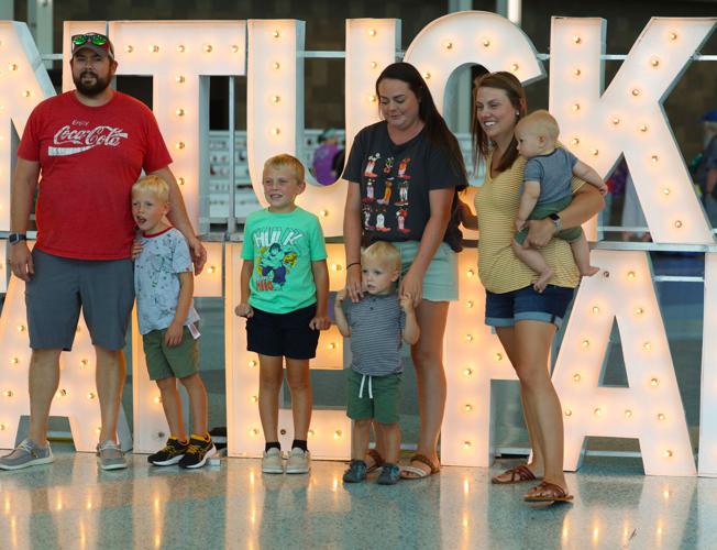 Family poses for photo at state fair.JPG