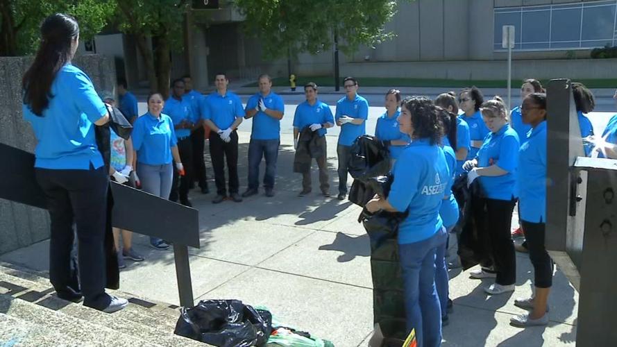 Volunteers assemble before street clean up