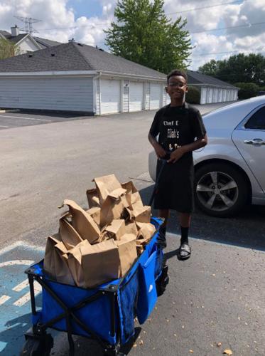 Elijah Foster cooking for the homeless of Wheeler Mission on his 12th birthday