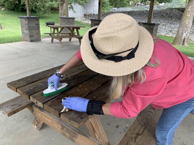 Women cleaning benches after 'Kookout'