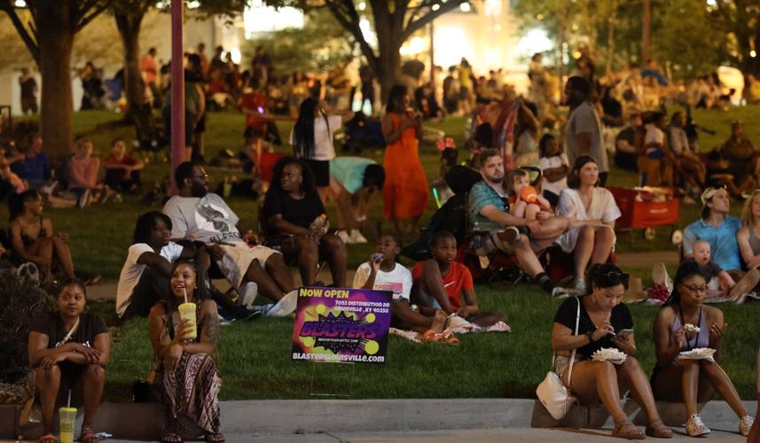People watch fireworks from Humana Park