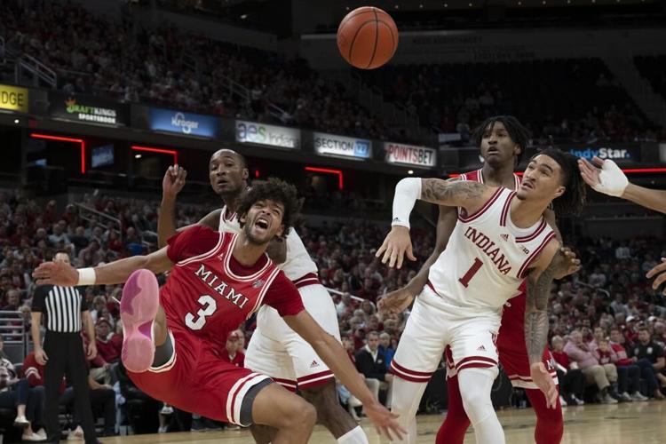 Miami guard Julian Lewis and Indiana guard Jalen Hood Schifino.jpeg