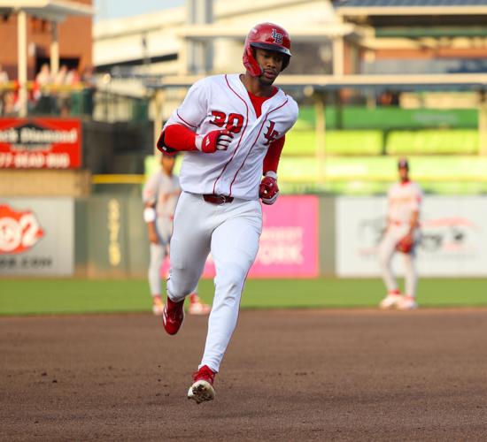 Will Benson rounds third after a home run.JPG