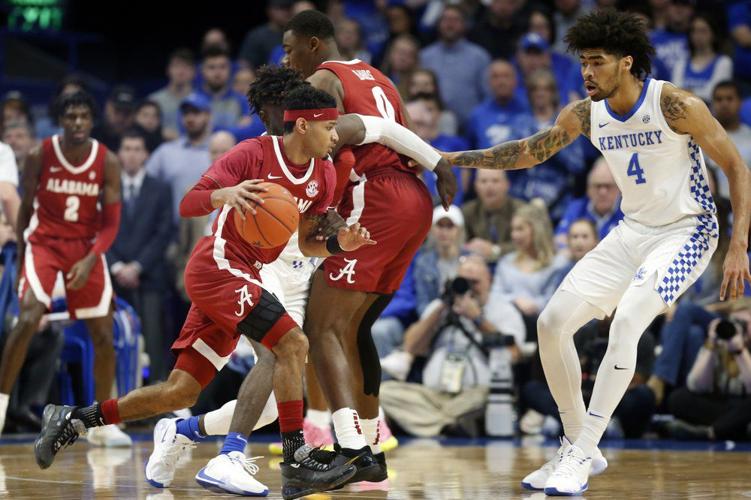 Alabama's James Bolden, left, looks for an opening on Kentucky's Nick Richards