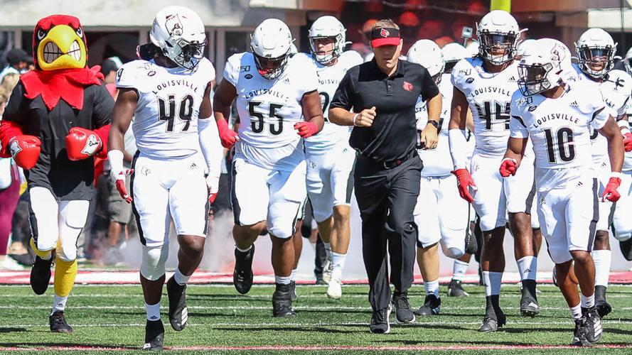 Scott Satterfield and the U of L football team take the field