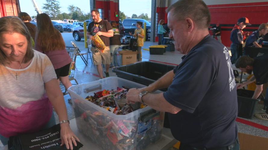 Volunteers pack candy bags for Zoneton Fire Halloween 2021 (1).jpeg