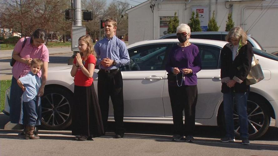 People pray at rally for LMPD officer.jpeg