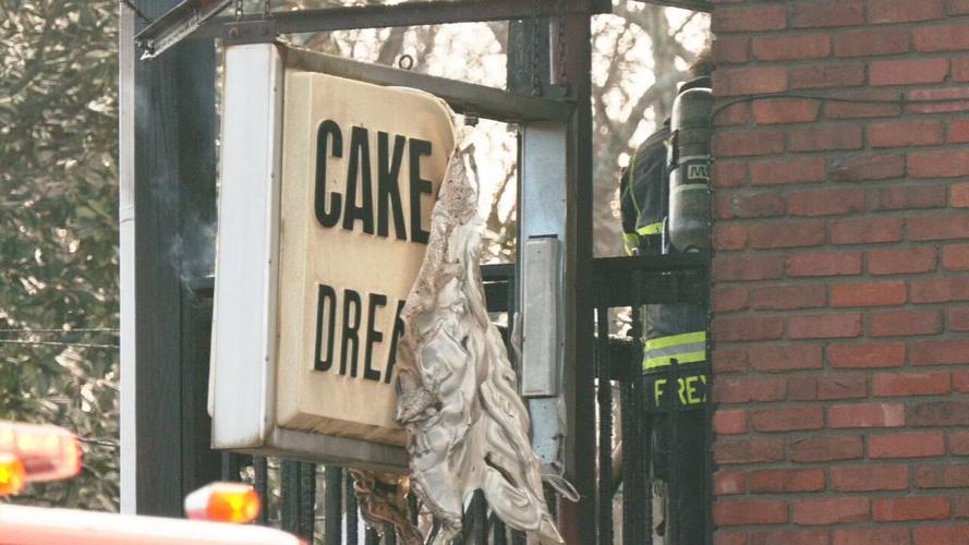 Cake Ladies Dream Shoppe sign on burned building in New Albany
